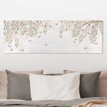 Impression sur toile - Les fleurs de cerisier dans le jeu d'ailes des papillons - Panorama 3:1
