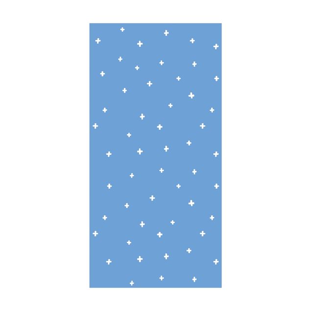 tapis contemporain Croix blanches dessinées sur bleu