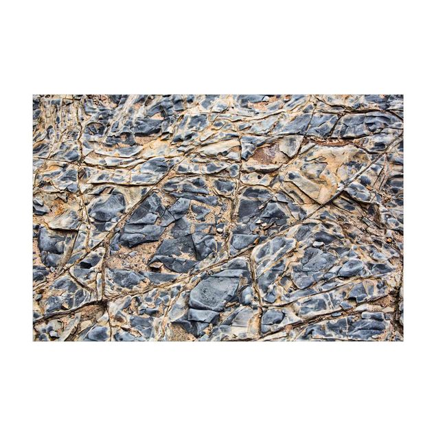 tapis modernes Souterrain rocheux gris sur la plage
