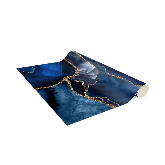 tapis salon moderne Vagues à paillettes dorées sur fond bleu