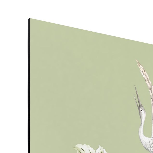 Tableau vert Aquarelle - Cigognes en vol avec des fleurs sur un fond vert
