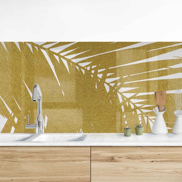 Déco murale cuisine Vue à travers des feuilles de palmier dorées