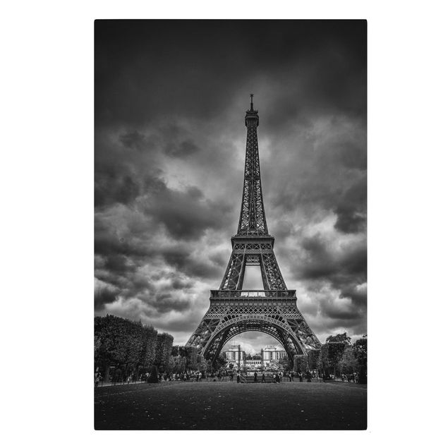 Tableaux sur toile en noir et blanc Tour Eiffel devant des nuages en noir et blanc