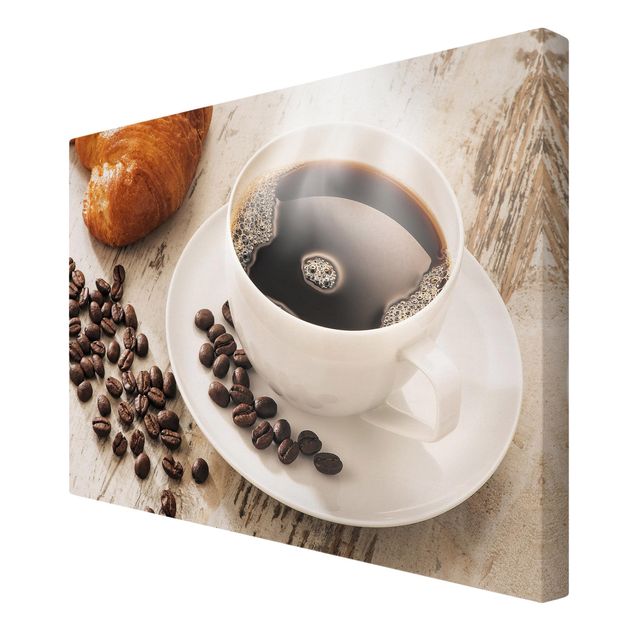 Tableaux toile Tasse de café à la vapeur avec des grains de café