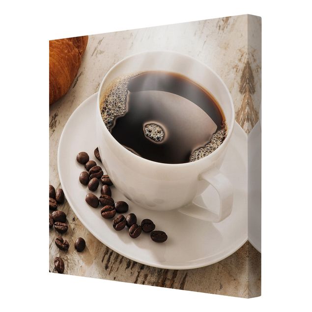 Tableaux toile Tasse de café à la vapeur avec des grains de café