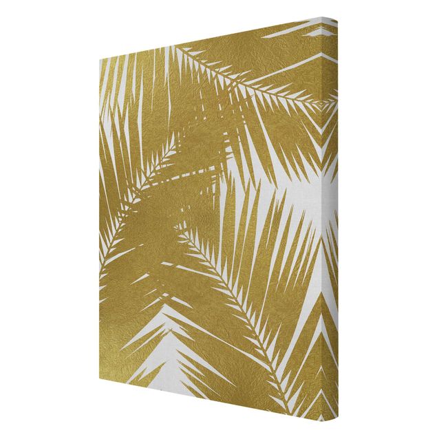 Tableau décoration Vue à travers des feuilles de palmier dorées