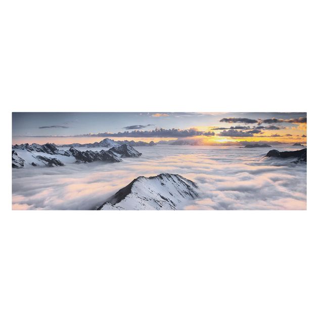 Tableau toile coucher de soleil Vue de nuages et de montagnes