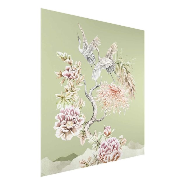 Tableaux modernes Aquarelle - Cigognes en vol avec des fleurs sur un fond vert