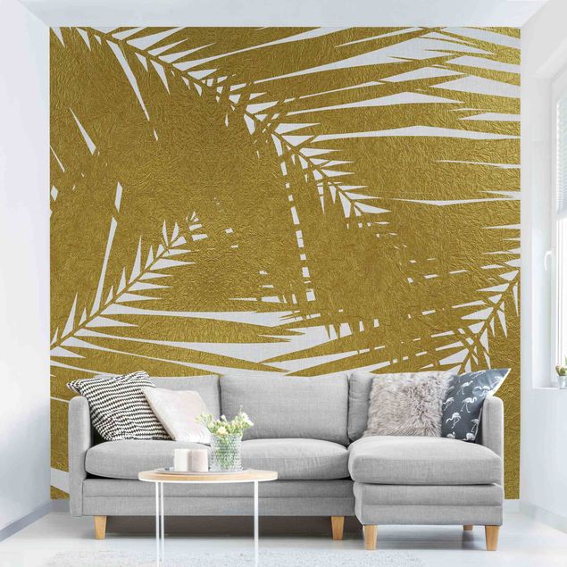 Déco mur cuisine Vue à travers des feuilles de palmier dorées