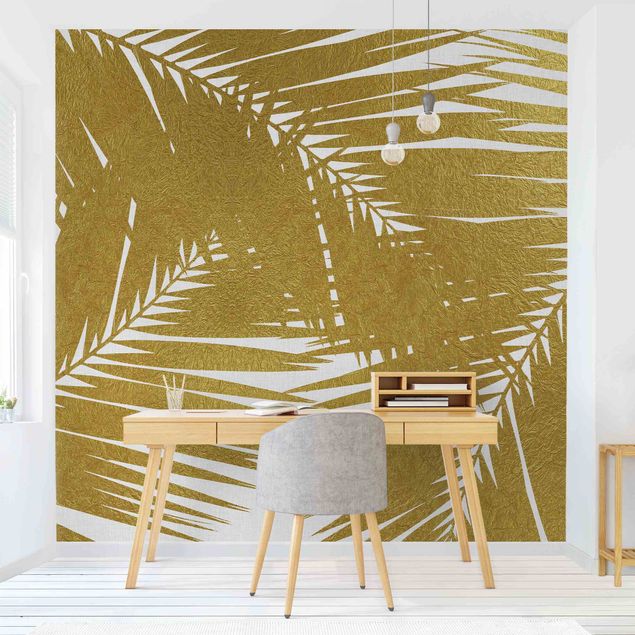 Tapisserie moderne Vue à travers des feuilles de palmier dorées