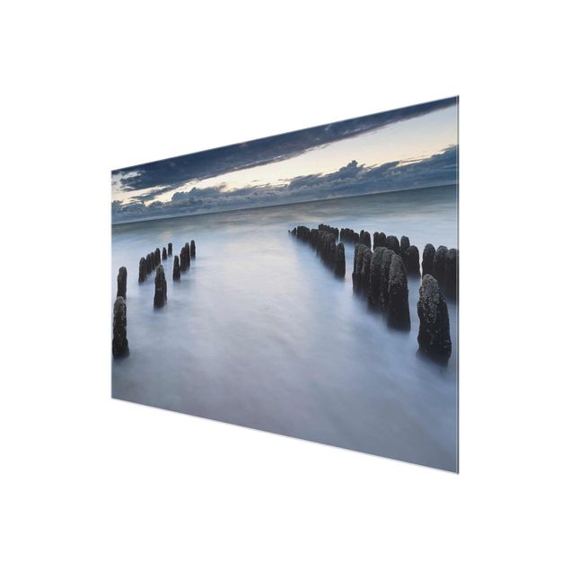 Tableau verre paysage Vieux poteaux en bois dans la mer du Nord à Sylt