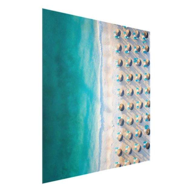 Tableau bord de mer Plage de sable blanc avec parasols de paille