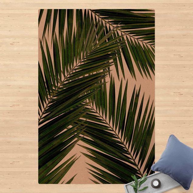 tapis salon moderne Vue à travers des feuilles de palmier vertes