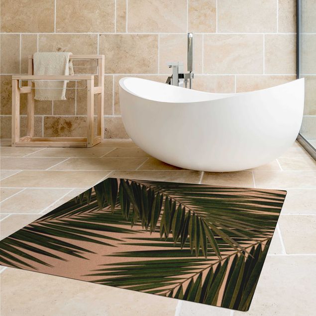 tapis de bain vert Vue à travers des feuilles de palmier vertes