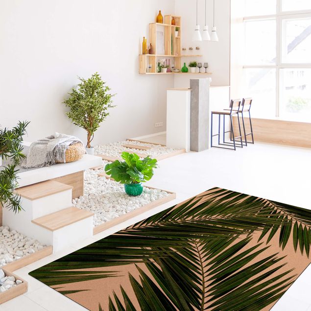 tapis salon vert Vue à travers des feuilles de palmier vertes