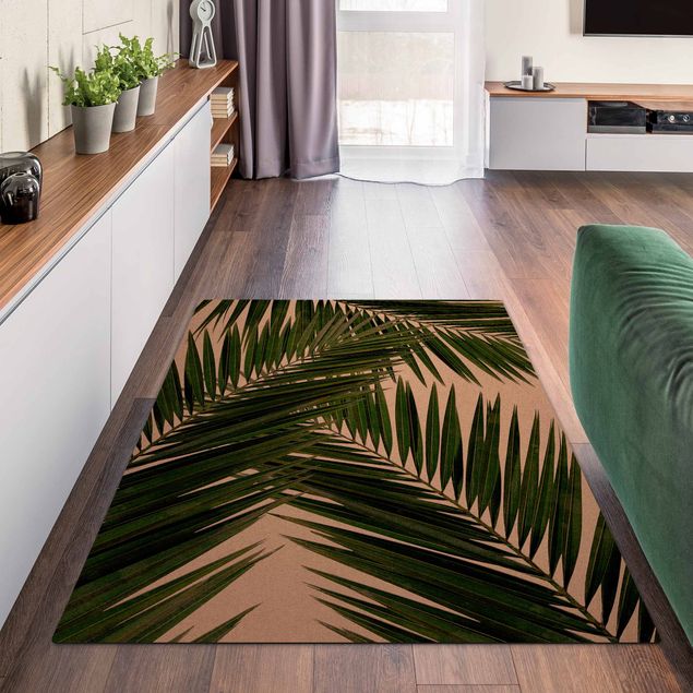 tapis chambre jungle Vue à travers des feuilles de palmier vertes