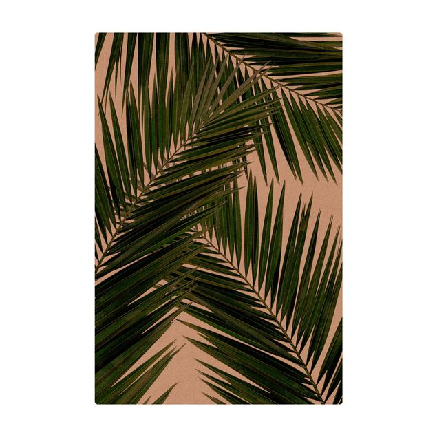 grand tapis salon Vue à travers des feuilles de palmier vertes