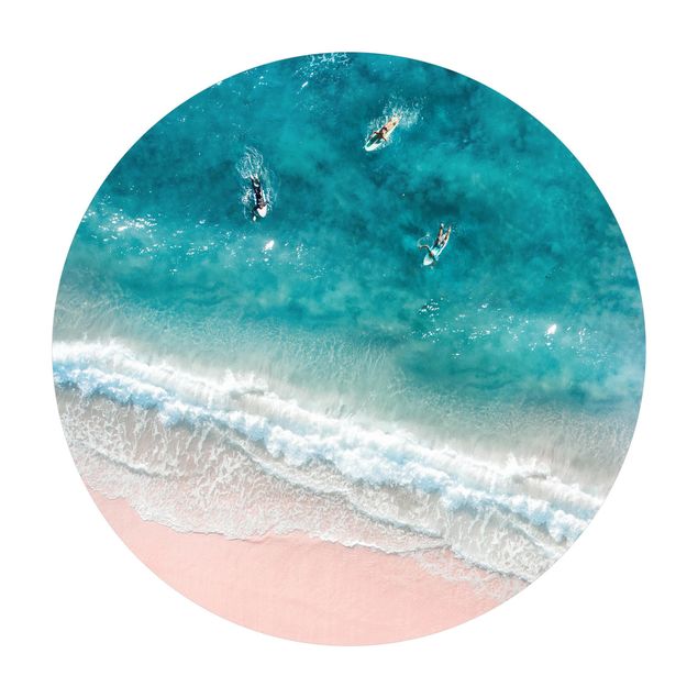 Tapis vinyle Trois surfeurs pagayant vers le rivage