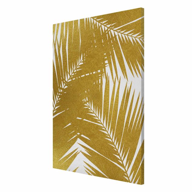 Tableaux magnétiques avec fleurs Vue à travers des feuilles de palmier dorées