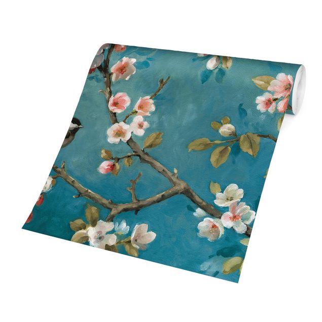 Papier peint animaux forêt Branches de fleurs de cerisier sur fond bleu