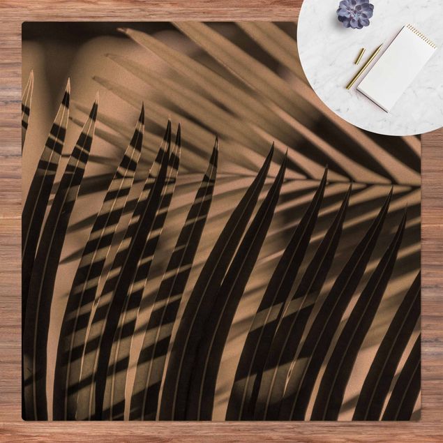 tapis salon moderne Jeu d'ombres sur une branche de palmier