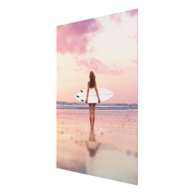 Tableaux sport Surfeuse avec une planche au coucher du soleil