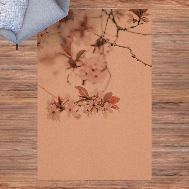 tapis contemporain Délicates fleurs de cerisier sur une brindille